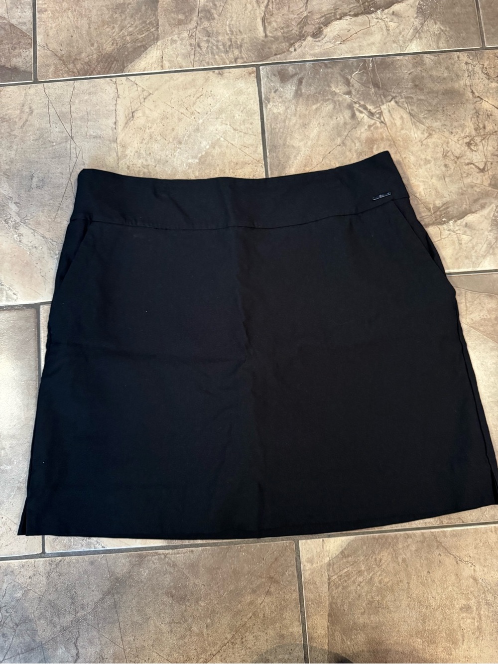 Black golf or tennis skirt with built in shorts and pockets